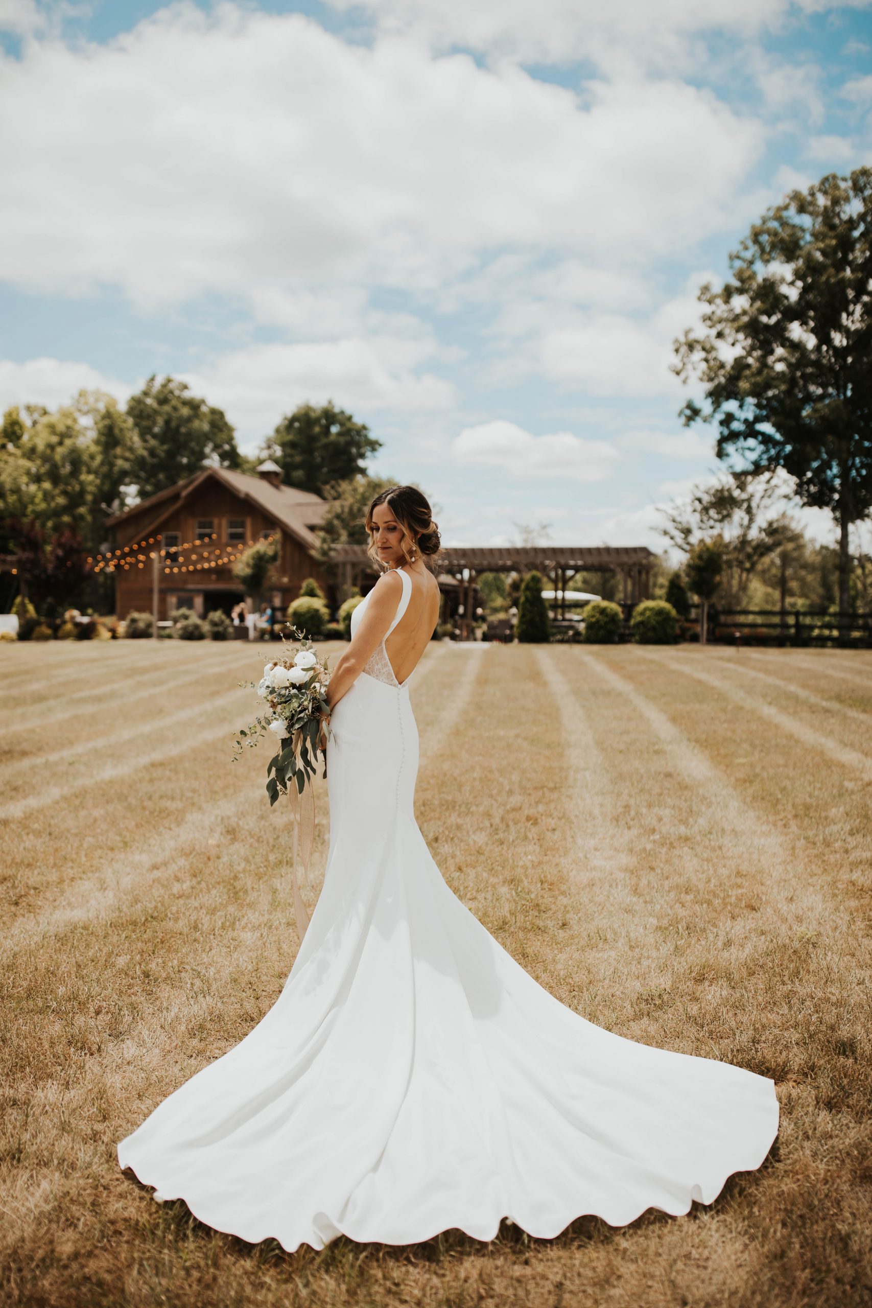 Low back long train crepe wedding dress