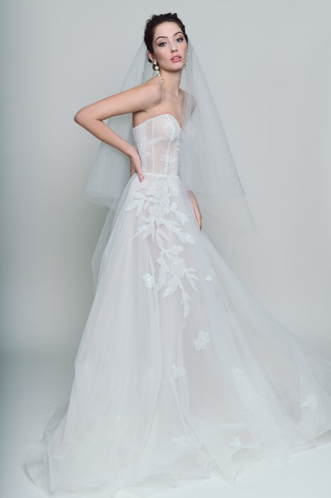 Ethereal strapless A-line wedding dress with a lace bodice and flowing OFF WHITE tulle skirt, perfect for a romantic wedding.